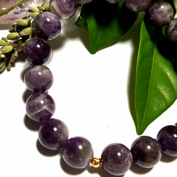 Handmade Refocusing Bracelet – Handmade Amethyst & Crown Chakra Crystal Bracelet close up of beads and knot cover